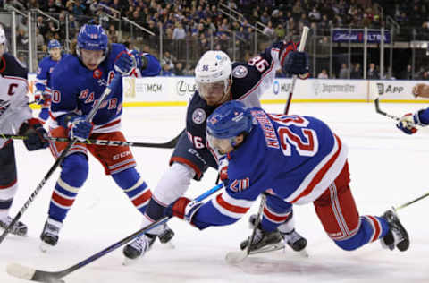 NEW YORK, NEW YORK – OCTOBER 23: Jack Roslovic #96 of the Columbus Blue Jackets takes the faceoff against Chris Kreider #20 of the New York Rangers at Madison Square Garden on October 23, 2022, in New York City. The Blue Jackets defeated the Rangers 5-1. (Photo by Bruce Bennett/Getty Images)