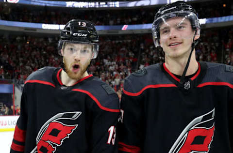 RALEIGH, NC – MAY 03: Warren Foegele #13 of the Carolina Hurricanes celebrates with teammate Andrei Svechnikov #37 following a victory in Game Four of the Eastern Conference Second Round against the New York Islanders during the 2019 NHL Stanley Cup Playoffs on May 3, 2019 at PNC Arena in Raleigh, North Carolina. (Photo by Gregg Forwerck/NHLI via Getty Images)