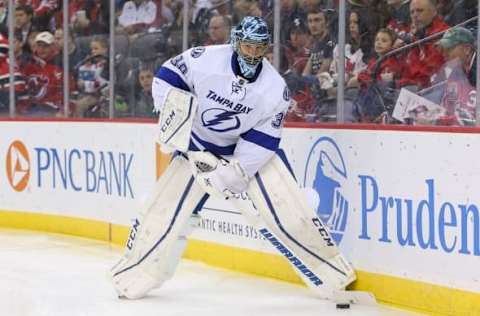 Apr 7, 2016; Newark, NJ, USA; Tampa Bay Lightning goalie Ben Bishop (30) clears the puck during the second period against the New Jersey Devils at Prudential Center. Mandatory Credit: Ed Mulholland-USA TODAY Sports