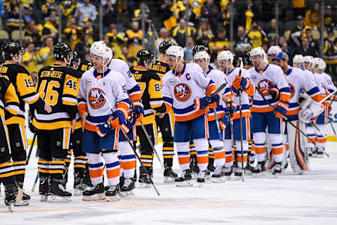 PITTSBURGH, PA – APRIL 16: The New York Islanders and Pittsburgh Penguins shake hands at the end Game 4 in the First Round of the 2019 NHL Stanley Cup Playoffs between the New York Islanders and the Pittsburgh Penguins on April 16, 2019, at PPG Paints Arena in Pittsburgh, PA. The New York Islanders won the series 4-0. (Photo by Jeanine Leech/Icon Sportswire via Getty Images)