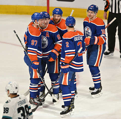 Apr 13, 2023; Edmonton, Alberta, CAN; Edmonton Oilers centre Connor McDavid (97) celebrates a goal with center Ryan Nugent-Hopkins (93) and centre Leon Draisaitl (29) defenseman Evan Bouchard (2) and left wing Zach Hyman (18) during the first period at Rogers Place. Mandatory Credit: Walter Tychnowicz-USA TODAY Sports