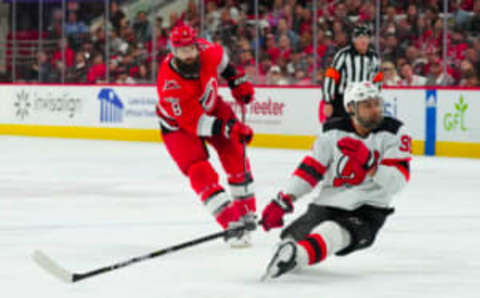 May 11, 2023; Raleigh, North Carolina, USA; Carolina Hurricanes defenseman Brent Burns (8) shoots against New Jersey Devils right wing Timo Meier (96) during the third period in game five of the second round of the 2023 Stanley Cup Playoffs at PNC Arena. Mandatory Credit: James Guillory-USA TODAY Sports