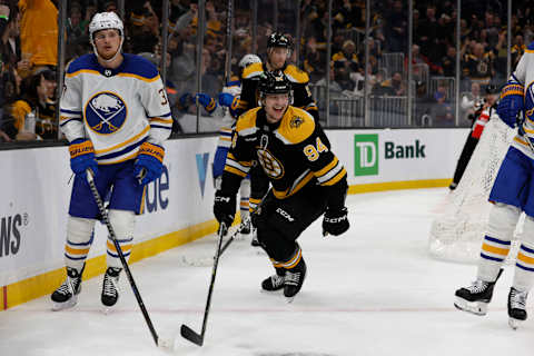 Mar 2, 2023; Boston, Massachusetts, USA; Boston Bruins center Jakub Lauko (94) smiles after scoring as Buffalo Sabres center Casey Mittelstadt (37) skates by during the third period at TD Garden. Mandatory Credit: Winslow Townson-USA TODAY Sports