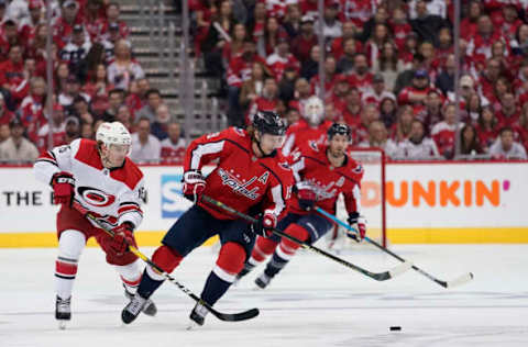 WASHINGTON, DC – APRIL 20: Nicklas Backstrom #19 of the Washington Capitals and Aleksi Saarela #15 of the Carolina Hurricanes skate after the puck in the first period in Game Five of the Eastern Conference First Round during the 2019 NHL Stanley Cup Playoffs at Capital One Arena on April 20, 2019 in Washington, DC. (Photo by Patrick McDermott/NHLI via Getty Images)