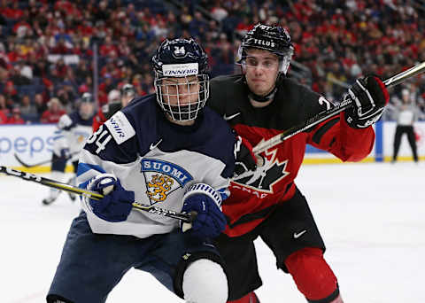 BUFFALO, NY – DECEMBER 26: Rasmus Kupari #34 of Finland and Brett Howden #21 of Canada during the second period at KeyBank Center on December 26, 2017 in Buffalo, New York. (Photo by Kevin Hoffman/Getty Images)