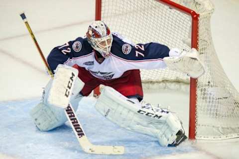 Oct 23, 2014; San Jose, CA, USA; Columbus Blue Jackets goalie Sergei Bobrovsky (72) looks for the puck against the San Jose Sharks during the first period at SAP Center at San Jose. Mandatory Credit: Ed Szczepanski-USA TODAY Sports