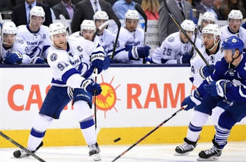 NHL Predictions: Tampa Bay Lightning center Steven Stamkos (91) sends a pass across ice as right wing Ryan Callahan (24) battles to get past Toronto Maple Leafs right wing Michael Grabner (40) in the second period at Air Canada Centre. The Leafs won 4-1. Mandatory Credit: Dan Hamilton-USA TODAY Sports