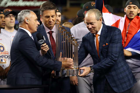 LOS ANGELES, CA – NOVEMBER 1: MLB Robert D. Manfred Jr. presents the Commissioner’s Trophy to the Houston Astros owner Jim Crane(Photo by Alex Trautwig/MLB via Getty Images)