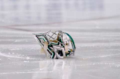 Feb 10, 2015; Boston, MA, USA; The mask of Dallas Stars goalie Kari Lehtonen (32) rests on the ice during the national anthem prior to a game against the Boston Bruins at TD Banknorth Garden. Mandatory Credit: Bob DeChiara-USA TODAY Sports