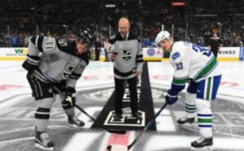 LOS ANGELES, CA – OCTOBER 22: Anze Kopitar #11 of the Los Angeles Kings, Former Los Angeles Kings Defenseman Jaroslav Modry, and Henrik Sedin #33 of the Vancouver Canucks participate in a ceremonial puck drop as part of the Los Angeles Kings 50th Anniversary Heritage Night at STAPLES Center on October 22, 2016 in Los Angeles, California. (Photo by Andrew D. Bernstein/NHLI via Getty Images)