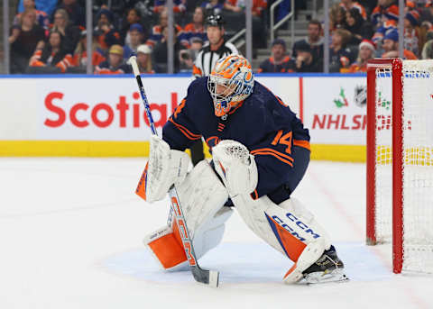 EDMONTON, CANADA – DECEMBER 14: Stuart Skinner #74 of the Edmonton Oilers try to look through a screen in the second period against the Tampa Bay Lightning on December 14, 2023 at Rogers Place in Edmonton, Alberta, Canada. (Photo by Lawrence Scott/Getty Images)