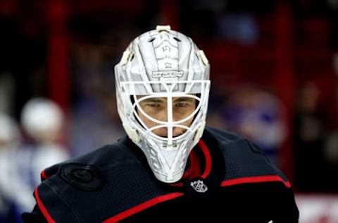 RALEIGH, NC – MARCH 08: Curtis McElhinney #35 of the Carolina Hurricanes skates back to the bench during warmups prior to an NHL game against the Winnipeg Jets on March 8, 2019 at PNC Arena in Raleigh, North Carolina. (Photo by Gregg Forwerck/NHLI via Getty Images)