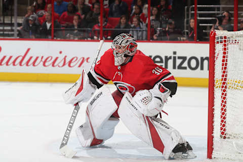 RALEIGH, NC – MARCH 2: Cam Ward #30 of the Carolina Hurricanes crouches in the crease to protect the net during an NHL game against the New Jersey Devils on March 2, 2018 at PNC Arena in Raleigh, North Carolina. (Photo by Gregg Forwerck/NHLI via Getty Images)