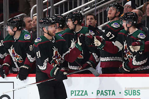 GLENDALE, ARIZONA – JANUARY 12: Taylor Hall #91 of the Arizona Coyotes celebrates with teammates on the bench after scoring against the Pittsburgh Penguins during the second period of the NHL game at Gila River Arena on January 12, 2020 in Glendale, Arizona. (Photo by Christian Petersen/Getty Images)