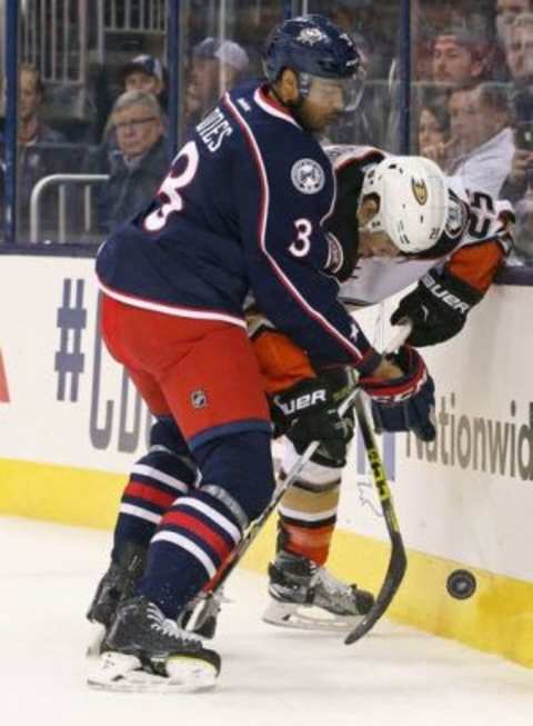 Feb 11, 2016; Columbus, OH, USA; Columbus Blue Jackets defenseman Seth Jones (3) checks Anaheim Ducks center Mike Santorelli (25) along the boards in the first period at Nationwide Arena. Mandatory Credit: Aaron Doster-USA TODAY Sports