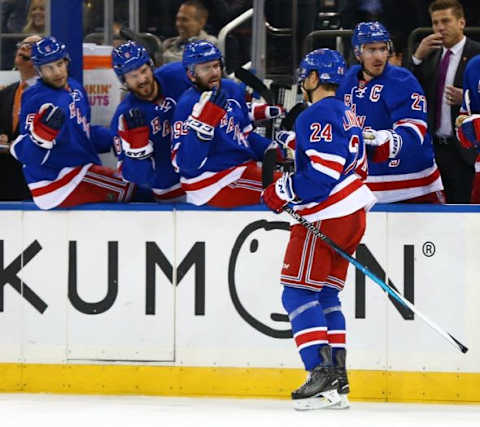 Oct 25, 2015; New York, NY, USA; New York Rangers center Oscar Lindberg (24) is congratulated after scoring a second period goal against the Calgary Flames at Madison Square Garden. Mandatory Credit: Andy Marlin-USA TODAY Sports