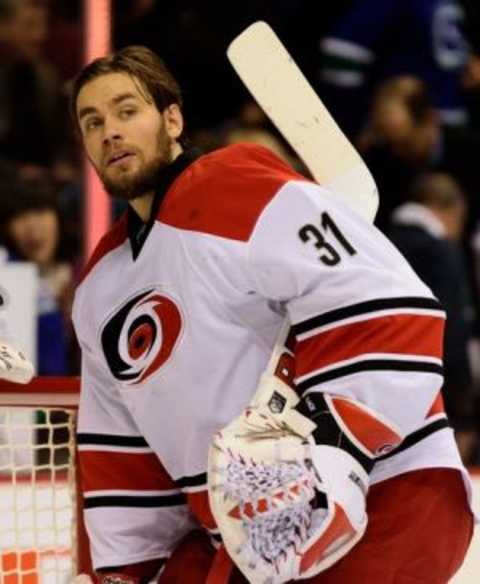 Jan 6, 2016; Vancouver, British Columbia, CAN; Carolina Hurricanes goaltender Eddie Lack (31) awaits the start of play against the Vancouver Canucks before the start of the first period at Rogers Arena. The Vancouver Canucks won 3-2. Mandatory Credit: Anne-Marie Sorvin-USA TODAY Sports