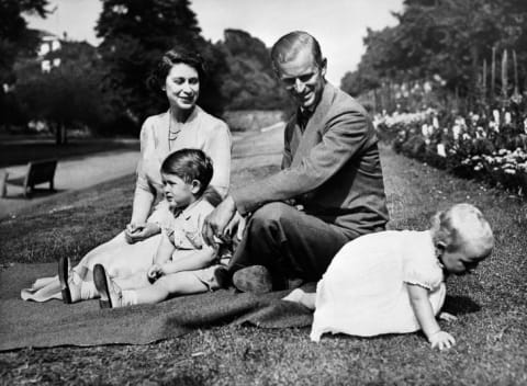 Queen Elizabeth and Prince Philip with two of their children, Prince Charles and Princess Anne, circa 1951.