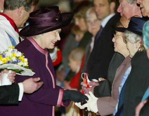 Queen Elizabeth II hands out maundy money in 2004.