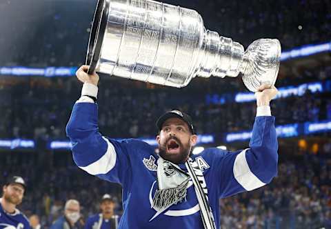 Jul 7, 2021; Tampa, Florida, USA; Tampa Bay Lightning left wing Alex Killorn (17) hoists the Stanley Cup after the Lightning defeated the Montreal Canadiens 1-0 in game five to win the 2021 Stanley Cup Final at Amalie Arena. Mandatory Credit: Kim Klement-USA TODAY Sports