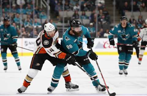 SAN JOSE, CA – OCTOBER 03: Brent Burns #88 of the San Jose Sharks and Kiefer Sherwood #64 of the Anaheim Ducks go for the puck at SAP Center on October 3, 2018, in San Jose, California. (Photo by Ezra Shaw/Getty Images)