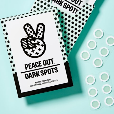 Peace Out dark spot removing dots next to their packaging