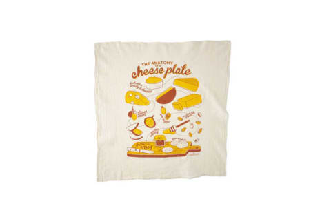 A dish towel with an illustration of cheeses and a cutting board on it