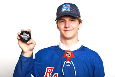 Vitaly Kravtsov poses after being selected ninth overall by the New York Rangers (Photo by Tom Pennington/Getty Images)