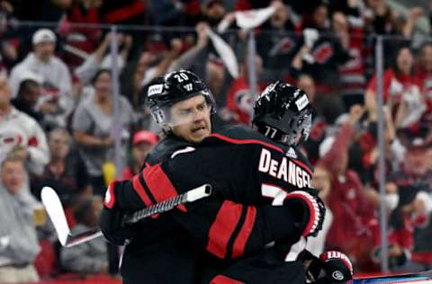 RALEIGH, NORTH CAROLINA – MAY 04: Sebastian Aho #20 celebrates with teammate Tony DeAngelo #77 of the Carolina Hurricanes after scoring a goal against the Boston Bruins during the second period of Game Two of the First Round of the 2022 Stanley Cup Playoffs at PNC Arena on May 04, 2022, in Raleigh, North Carolina. (Photo by Grant Halverson/Getty Images)