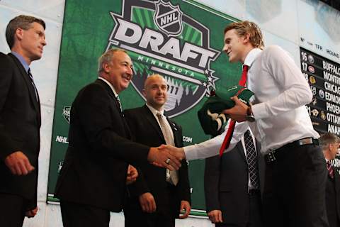 ST PAUL, MN – JUNE 24: Tenth overall pick Jonas Brodin by the Minnesota Wild shakes hands with Scout Guy Lapointe of the Minnesota Wild during day one of the 2011 NHL Entry Draft at Xcel Energy Center on June 24, 2011 in St Paul, Minnesota. (Photo by Dave Sandford/NHLI via Getty Images)