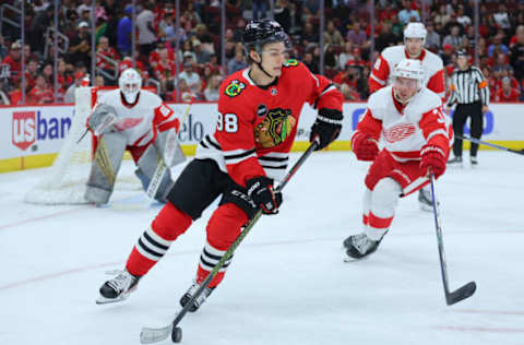 CHICAGO, ILLINOIS – OCTOBER 03: Connor Bedard #98 of the Chicago Blackhawks skates with the puck against the Detroit Red Wings during the third period of preseason game at the United Center on October 03, 2023 in Chicago, Illinois. (Photo by Michael Reaves/Getty Images)