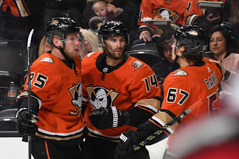 ANAHEIM, CA – OCTOBER 18: Adam Henrique #14, Ondrej Kase #25, and Rickard Rakell #67 of the Anaheim Ducks celebrate Henrique’s goal in the first period of the game against the Carolina Hurricanes at Honda Center on October 18, 2019, in Anaheim, California. (Photo by Robert Binder/NHLI via Getty Images)