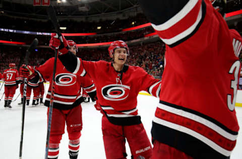 RALEIGH, NC – APRIL 4: Sebastian Aho #20 of the Carolina Hurricanes celebrates with goaltender Petr Mrazek #34 following their 3-1 win over the New Jersey Devils during an NHL game at PNC Arena on April 4, 2019, in Raleigh, North Carolina. (Photo by Gregg Forwerck/NHLI via Getty Images)