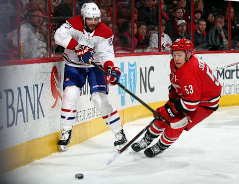 RALEIGH, NC – FEBRUARY 1: Jeff Skinner #53 of the Carolina Hurricanes plays a puck along the boards away from Alex Galchenyuk #27 of the Montreal Canadiens during an NHL game on February 1, 2018 at PNC Arena in Raleigh, North Carolina. (Photo by Gregg Forwerck/NHLI via Getty Images)