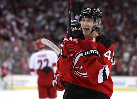 Jack Hughes #86 and Luke Hughes #43 of the New Jersey Devils. (Photo by Elsa/Getty Images)