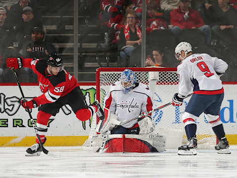 NEWARK, NJ – MARCH 19: Pheonix Copley #1 of the Washington Capitals makes a save against Kevin Rooney #58 of the New Jersey Devils during the second period at the Prudential Center on March 19, 2019 in Newark, New Jersey. (Photo by Andy Marlin/NHLI via Getty Images)