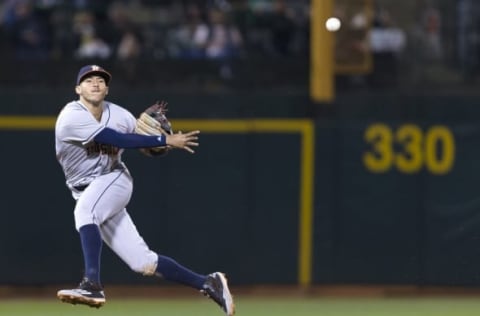 Sep 20, 2016; Oakland, CA, USA; Houston Astros shortstop Carlos Correa (1) throws out Oakland Athletics catcher Stephen Vogt (not pictured) during the sixth inning at the Oakland Coliseum. Mandatory Credit: Neville E. Guard-USA TODAY Sports