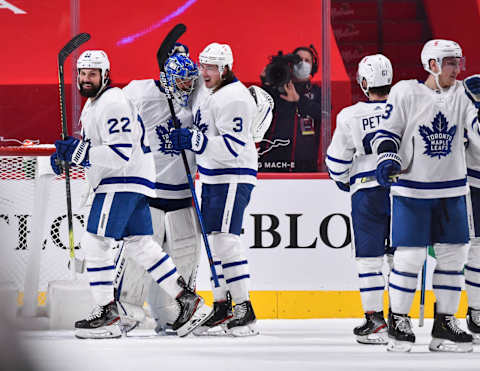 MONTREAL, QC – FEBRUARY 10: Zach Bogosian #22 and Justin Holl #3 of the Toronto Maple Leafs  . (Photo by Minas Panagiotakis/Getty Images)