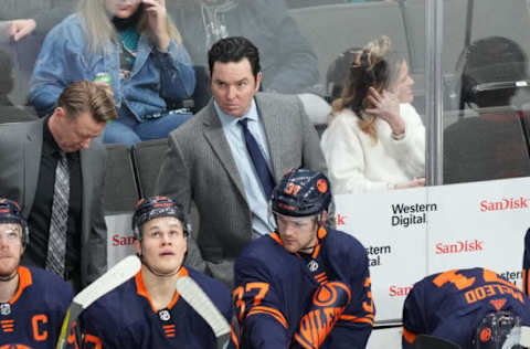 Feb 14, 2022; San Jose, California, USA; Edmonton Oilers head coach Jay Woodcroft stands behind the bench during the third period against the San Jose Sharks at SAP Center at San Jose. Mandatory Credit: Darren Yamashita-USA TODAY Sports