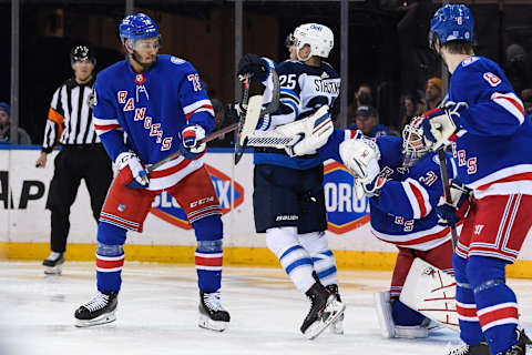 Apr 19, 2022; New York, New York, USA; Winnipeg Jets center Paul Stastny (25) attempts to deflect the puck in front of New York Rangers goaltender Igor Shesterkin (31) defended by New York Rangers defenseman K’Andre Miller (79) during the second period at Madison Square Garden. Mandatory Credit: Dennis Schneidler-USA TODAY Sports