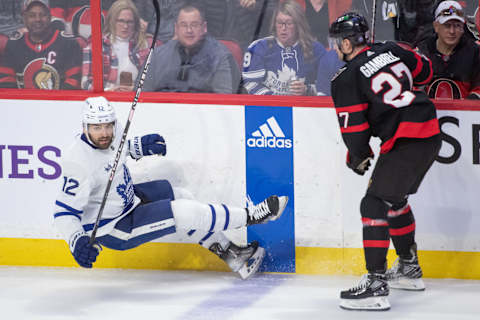 Apr 1, 2023; Ottawa, Ontario, CAN; Toronto Maple Leafs center Zach Aston-Reese (12) is checked by Ottawa Senators center Dylan Gambrell (27  Credit: Marc DesRosiers-USA TODAY Sports