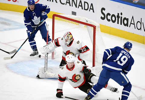 Feb 18, 2021; Toronto, Ontario, CAN; Ottawa Senators goalie Matt Murray (30) blocks a shot from Toronto Maple Leafs forward Jason Spezza   Mandatory Credit: Dan Hamilton-USA TODAY Sports