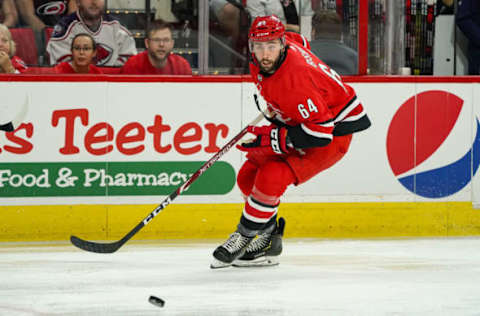 RALEIGH, NC – SEPTEMBER 29: Carolina Hurricanes center Clark Bishop (64) chases the puck up the ice during an NHL Preseason game between the Washington Capitals and the Carolina Hurricanes on September 29, 2019 at the PNC Arena in Raleigh, NC. (Photo by Greg Thompson/Icon Sportswire via Getty Images)