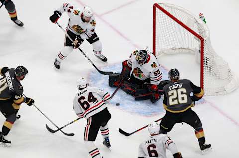 Corey Crawford #50 of the Chicago Blackhawks blocks a shot against the Vegas Golden Knights during the second period in Game One of the Western Conference First Round. (Photo by Jeff Vinnick/Getty Images)