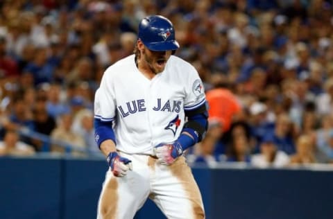 Jul 7, 2016; Toronto, Ontario, CAN; Toronto Blue Jays third baseman Josh Donaldson (20) reacts to getting hit by a pitch in the sixth inning during MLB game action against the Detroit Tigers at Rogers Centre. Blue Jays won 5-4. Mandatory Credit: Kevin Sousa-USA TODAY Sports