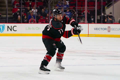 Jan 21, 2022; Raleigh, North Carolina, USA; Carolina Hurricanes defenseman Tony DeAngelo (77) scores a goal against the New York Rangers during the third period at PNC Arena. Mandatory Credit: James Guillory-USA TODAY Sports