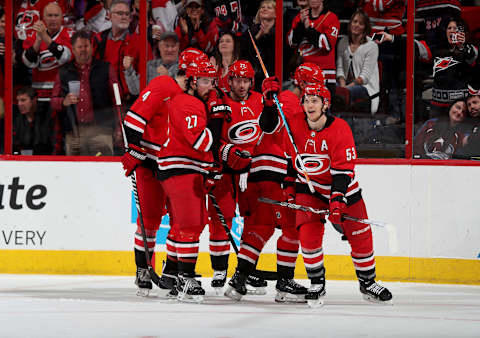 RALEIGH, NC – FEBRUARY 10: Jeff Skinner #53 of the Carolina Hurricanes celebrates with teammates after scoring a goal during an NHL game against the Colorado Avalanche on February 10, 2018 at PNC Arena in Raleigh, North Carolina. (Photo by Gregg Forwerck/NHLI via Getty Images)