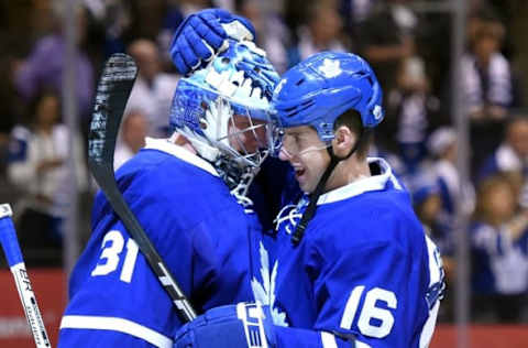 Oct 15, 2016; Toronto, Ontario, CAN; Toronto Maple Leafs forward Mitch Marner (16) embraces goalie Frederik Andersen (31) as they celebrate a 4-1 win over Boston Bruins at Air Canada Centre. Mandatory Credit: Dan Hamilton-USA TODAY Sports