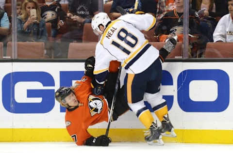 Anaheim Ducks defenseman Hampus Lindholm (47) is checked by Nashville Predators left wing James Neal (18). Mandatory Credit: Jake Roth-USA TODAY Sports