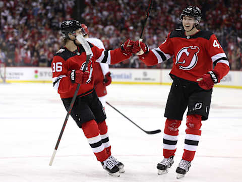 Jack Hughes #86 and Luke Hughes #43 of the New Jersey Devils. (Photo by Elsa/Getty Images)